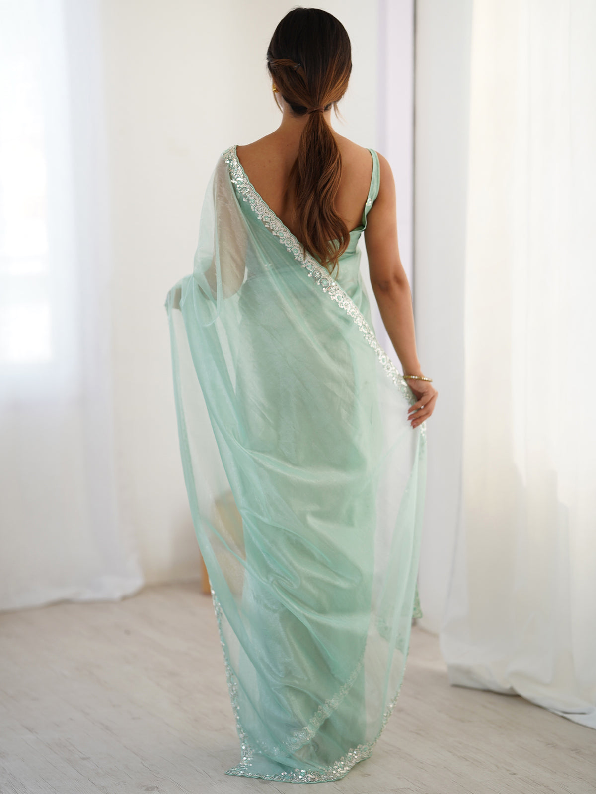 Women's Net Sequence Work Saree With Unstitched Blouse Piece